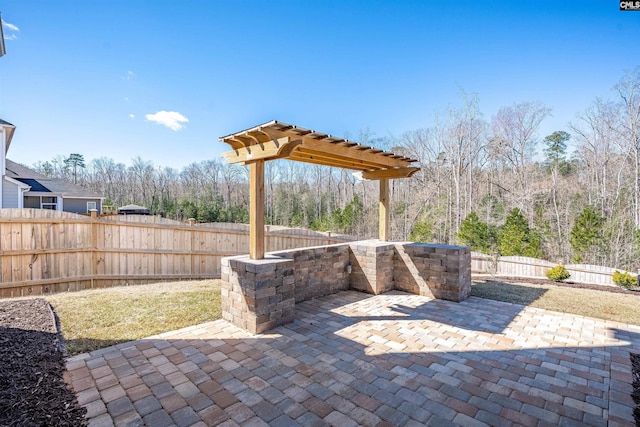 view of patio / terrace with a pergola and a fenced backyard