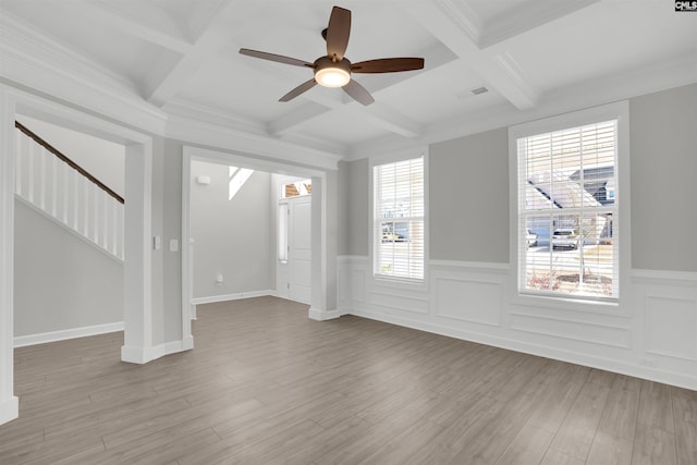 foyer entrance with beam ceiling, visible vents, coffered ceiling, and wood finished floors