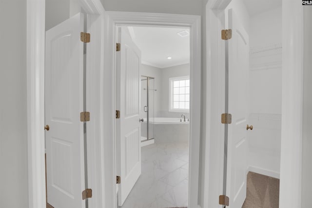 corridor featuring crown molding