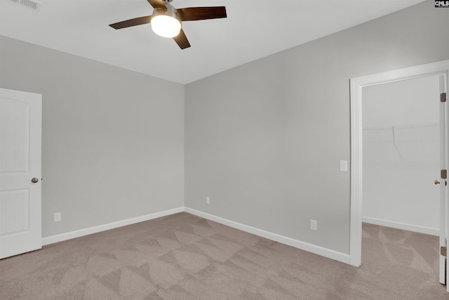 empty room with carpet flooring and baseboards