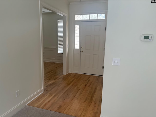 entrance foyer featuring baseboards and light wood-style flooring