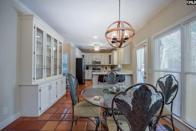 dining area featuring tile patterned flooring, baseboards, visible vents, and ornamental molding