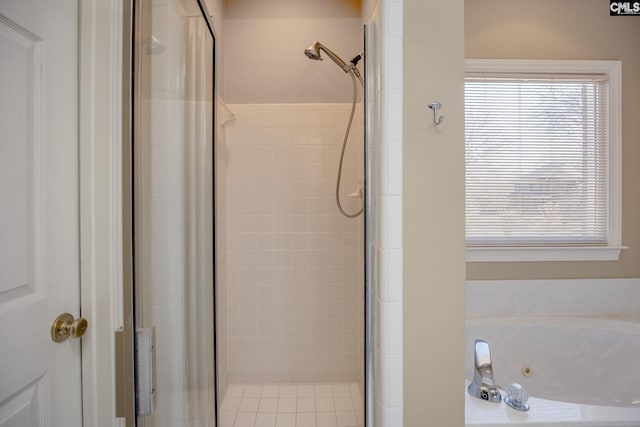 full bathroom featuring a shower stall and a jetted tub