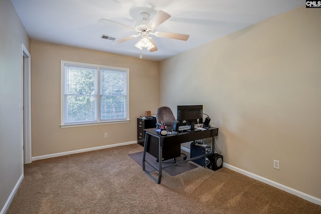 home office featuring visible vents, baseboards, carpet, and a ceiling fan