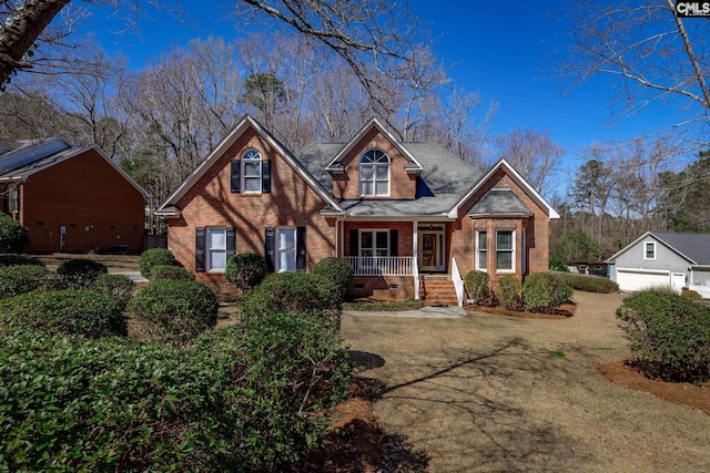 view of front of home featuring crawl space, brick siding, and covered porch