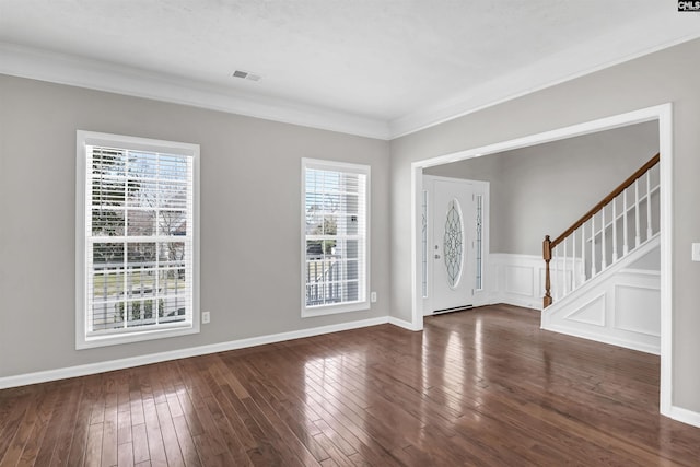 entryway featuring visible vents, dark wood-style floors, stairway, crown molding, and baseboards