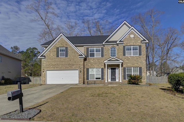 colonial house with brick siding, concrete driveway, a front yard, and fence