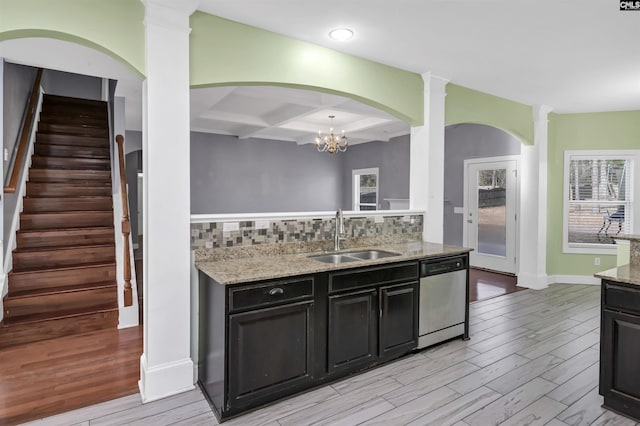 kitchen with stainless steel dishwasher, decorative backsplash, coffered ceiling, and a sink