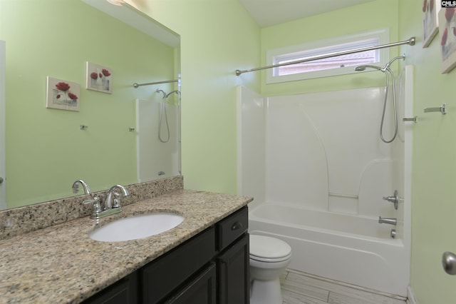 full bathroom featuring shower / bath combination, toilet, and vanity