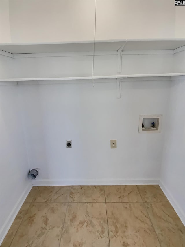 clothes washing area featuring baseboards, hookup for an electric dryer, washer hookup, and laundry area