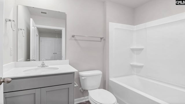 bathroom featuring visible vents, baseboards, toilet, shower / tub combination, and vanity