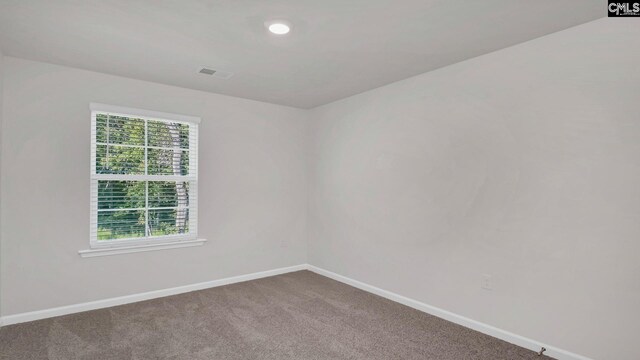 carpeted spare room featuring visible vents, recessed lighting, and baseboards