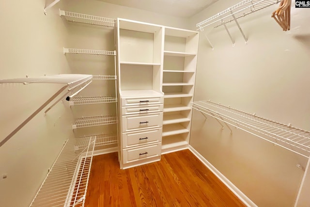 spacious closet with wood finished floors