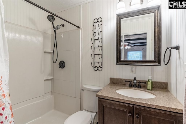 bathroom featuring vanity, a shower with shower curtain, and toilet