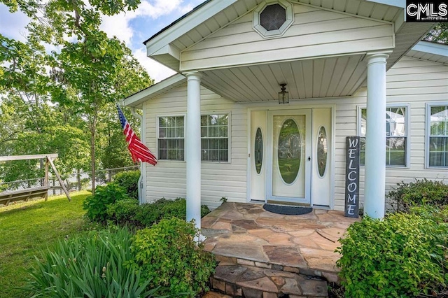 view of exterior entry with fence