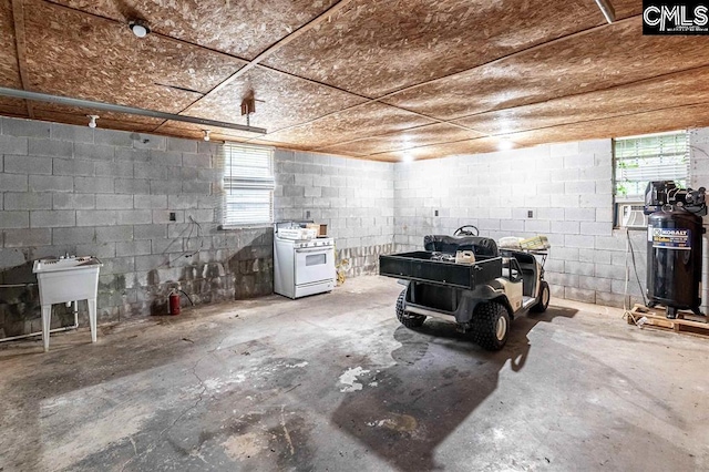 garage with concrete block wall