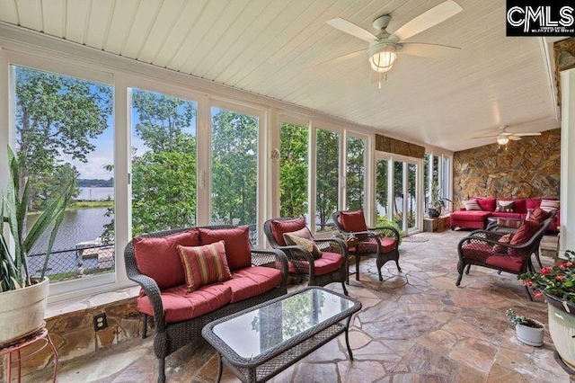 sunroom / solarium with a water view, wood ceiling, and a ceiling fan