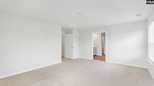 1304 Mosser Dr, Columbia, SC 29203 - unfurnished bedroom featuring baseboards, visible vents, carpet floors, and connected bathroom