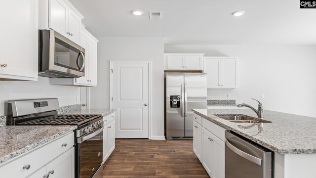 1304 Mosser Dr, Columbia, SC 29203 - kitchen featuring visible vents, a sink, dark wood-type flooring, white cabinets, and appliances with stainless steel finishes