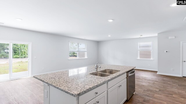 1304 Mosser Dr, Columbia, SC 29203 - kitchen with dark wood-type flooring, a kitchen island with sink, a sink, recessed lighting, and dishwasher