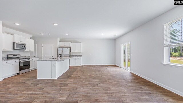 1304 Mosser Dr, Columbia, SC 29203 - kitchen featuring light wood-style flooring, appliances with stainless steel finishes, and white cabinets