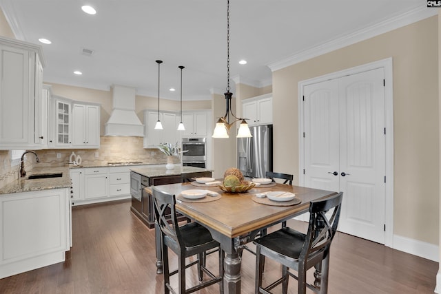 dining space with visible vents, recessed lighting, dark wood-type flooring, and ornamental molding