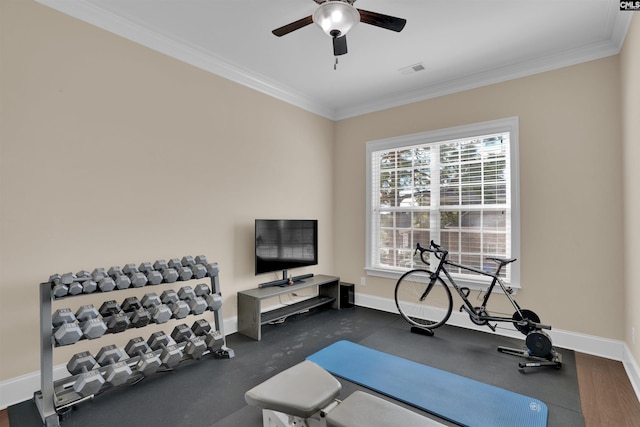 workout area with ceiling fan, visible vents, baseboards, and ornamental molding