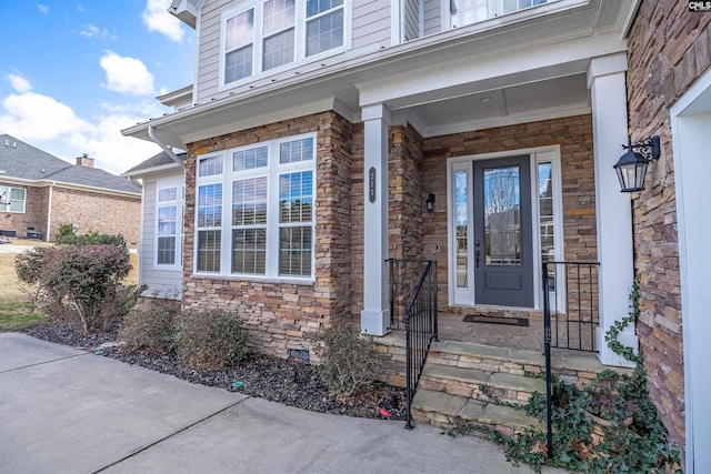 property entrance featuring crawl space and stone siding