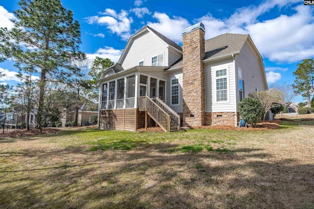 back of house with stairway, a lawn, a sunroom, and crawl space