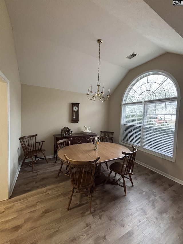 416 Knotts Ct, Lexington, SC 29073 - dining room with visible vents, lofted ceiling, wood finished floors, an inviting chandelier, and baseboards