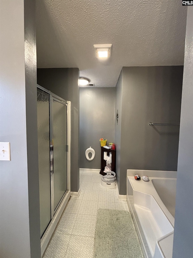 416 Knotts Ct, Lexington, SC 29073 - full bath with tile patterned floors, a stall shower, a textured ceiling, baseboards, and a bath