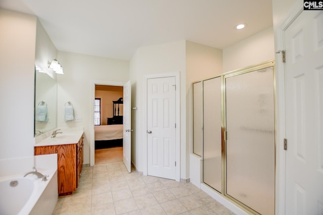 bathroom with vanity, a garden tub, a stall shower, and connected bathroom