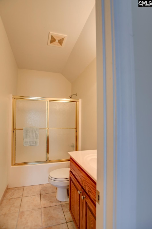 bathroom featuring visible vents, toilet, shower / bath combination with glass door, tile patterned floors, and vanity