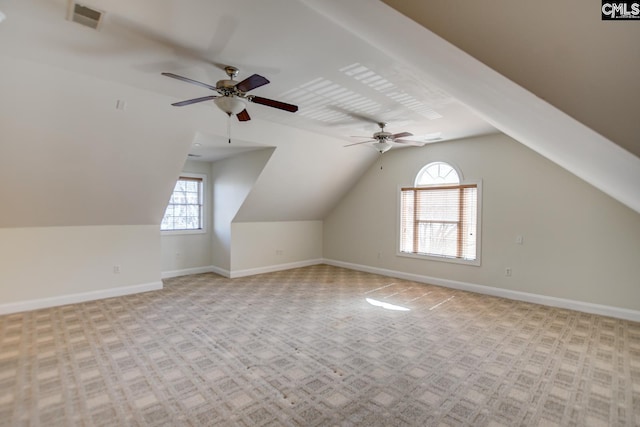 bonus room featuring visible vents, baseboards, and lofted ceiling