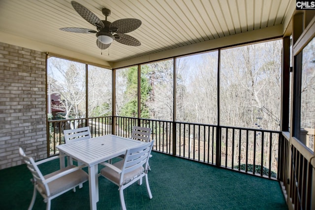 sunroom / solarium with ceiling fan