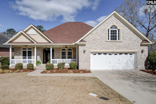 traditional home with brick siding, covered porch, and driveway