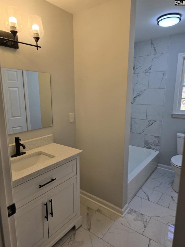 bathroom with baseboards, toilet, marble finish floor, and vanity