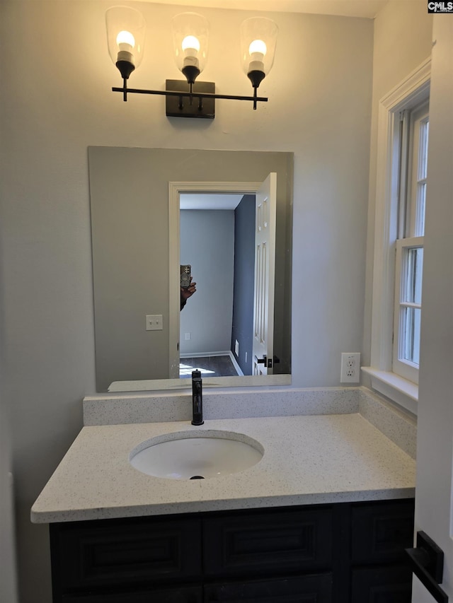 bathroom featuring plenty of natural light and vanity