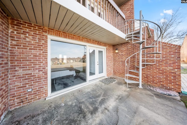 view of patio / terrace with stairs and french doors