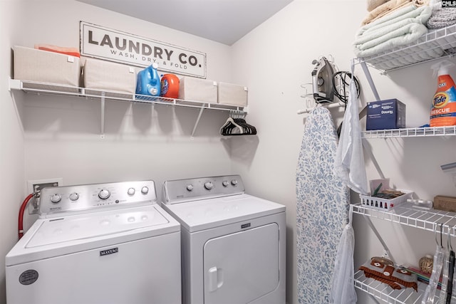 laundry room featuring laundry area and washer and clothes dryer