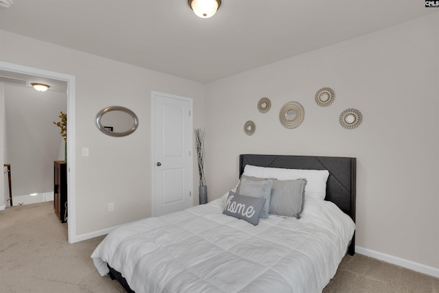 carpeted bedroom featuring baseboards