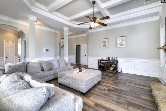 living room with stairway, ornate columns, arched walkways, a ceiling fan, and dark wood-style flooring