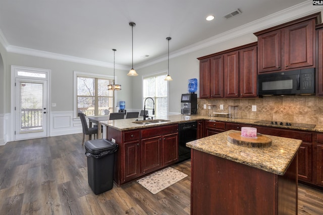 kitchen featuring dark wood finished floors, visible vents, black appliances, and a sink