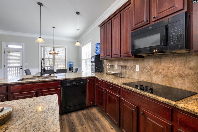 kitchen with black appliances, ornamental molding, reddish brown cabinets, and a sink