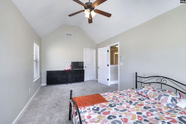 carpeted bedroom with visible vents, ceiling fan, baseboards, and vaulted ceiling