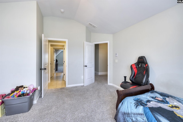 carpeted bedroom featuring vaulted ceiling, baseboards, and visible vents