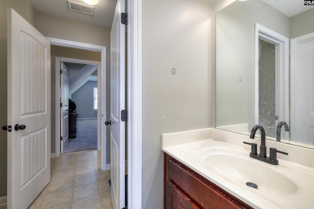 bathroom with tile patterned floors, visible vents, and vanity