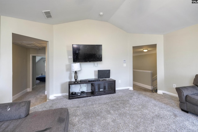 living room with lofted ceiling, baseboards, visible vents, and carpet floors