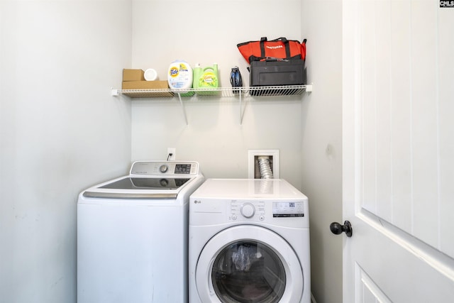 washroom featuring washer and clothes dryer and laundry area