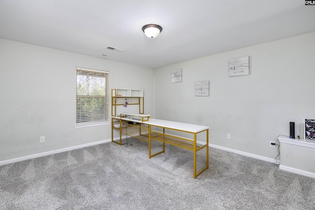 office with visible vents, baseboards, and carpet